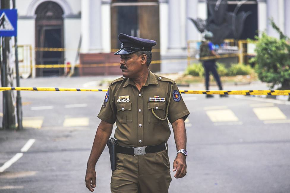 Colombo, Sri Lanka: A policeman walks away from the bomb-damaged St Anthonys Shrine, where over a hundred worshipers were killed by a suicide bomber on Easter Sunday morning. Three Roman Catholic churches in Colombo, Negombo, and Ba