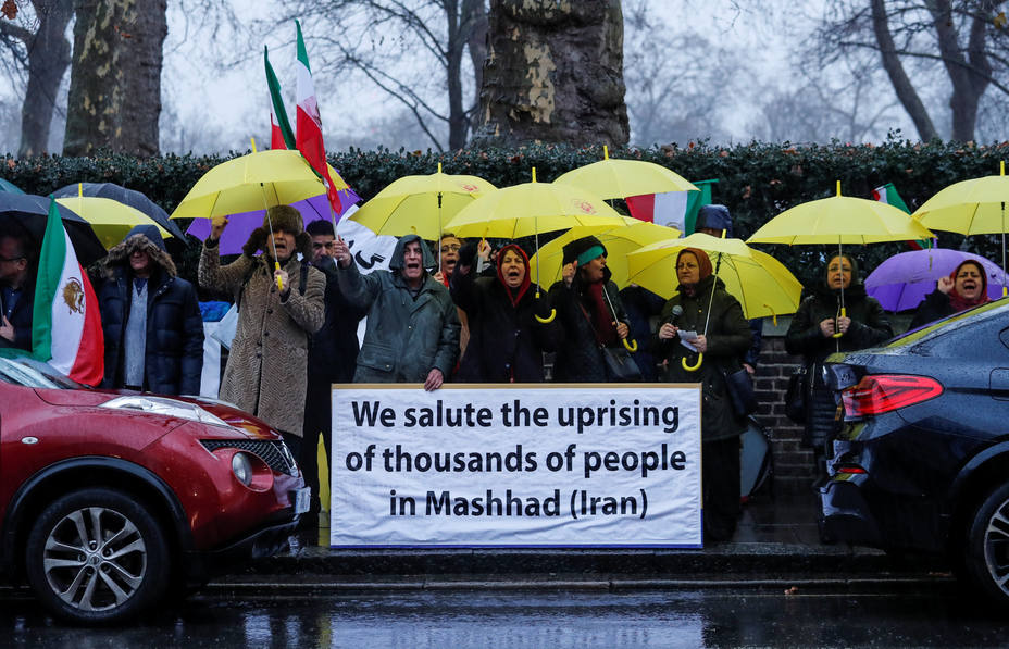 Opponents of Iranian President Hassan Rouhani hold a protest outside the Iranian embassy in west London