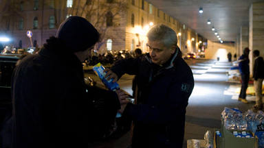 Father Konrad Krajewski during the distribution of meals to the poor at Termini Station