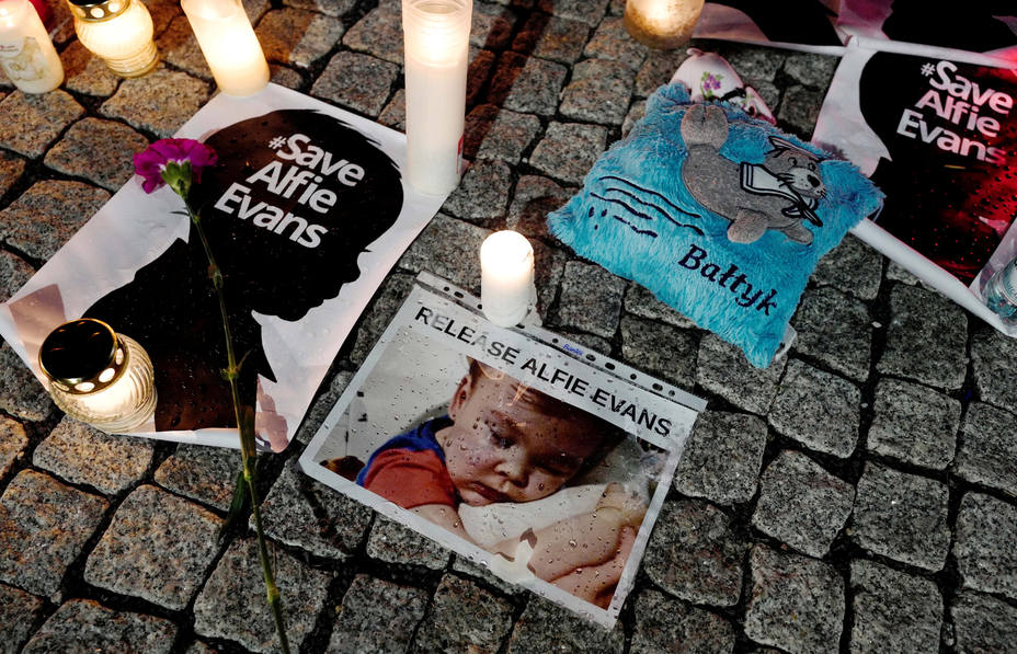 FILE PHOTO: Candles and placards are pictured during a protest in support of Alfie Evans, in front of the British Embassy building in Warsaw