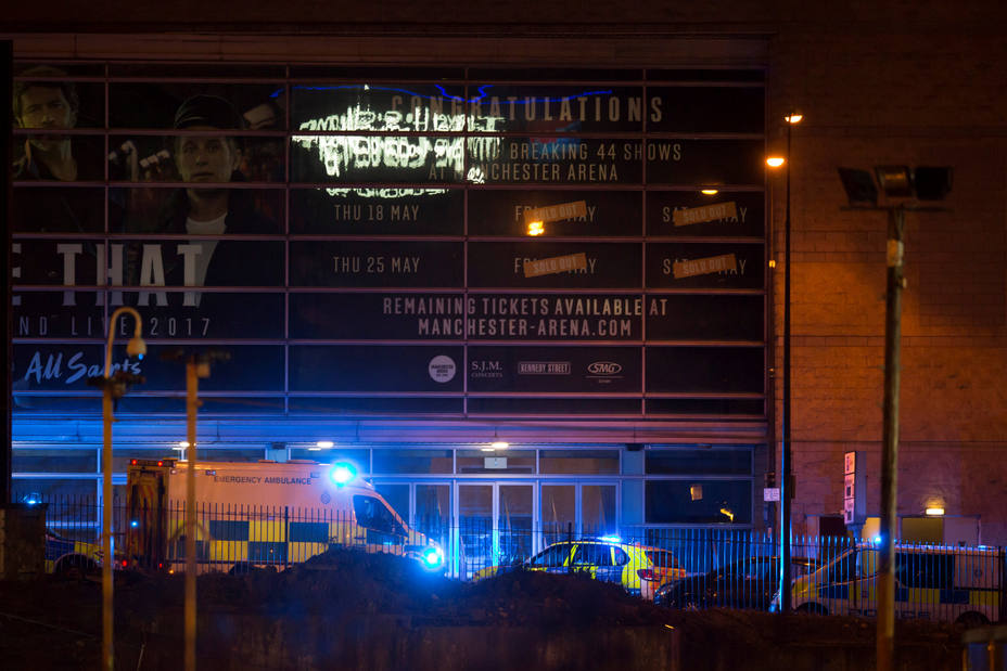 Police vans and ambulances are seen outside the Manchester Arena in northern England where U.S. singer Ariana Grande had been performing
