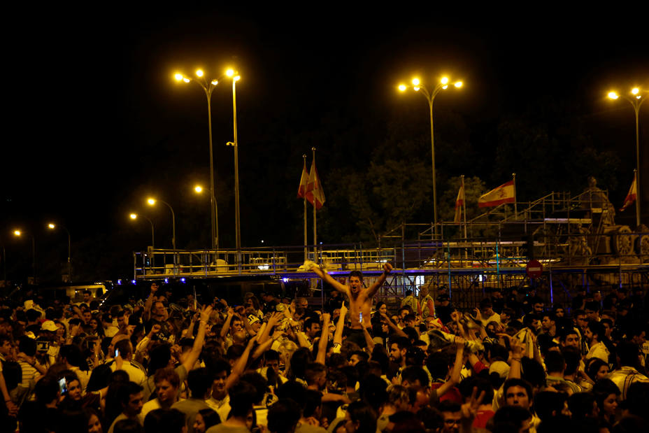 Real Madrid fans celebrate at the end of the Champions League final match at Cibeles Square.