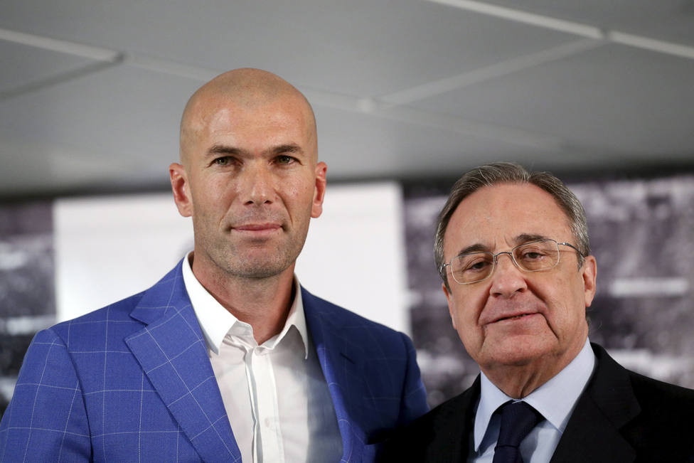 Real Madrids new coach Zidane and Real Madrids President Perez pose for the media at Santiago Bernabeu stadium in Madrid