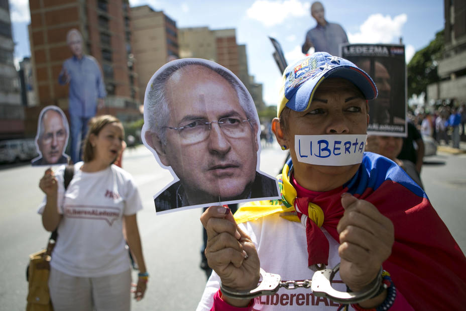 FILE PHOTO: Supporters of arrested Caracas metropolitan mayor Antonio Ledezma hold up a cutout of his face during a gathering in his support in Caracas