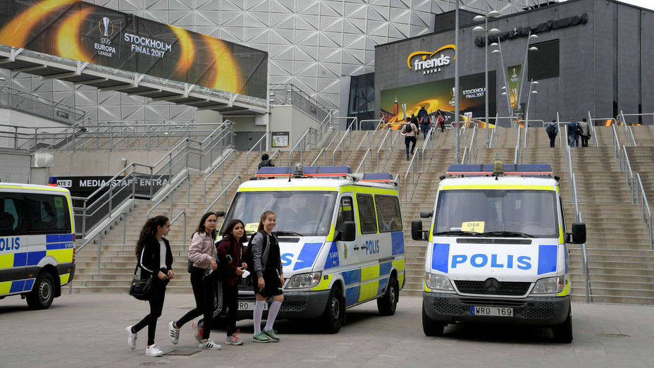 Police vans stand in front of the Friends Arena in Solna, outside Stockholm