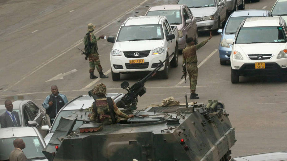 Military vehicles and soldiers patrol the streets in Harare
