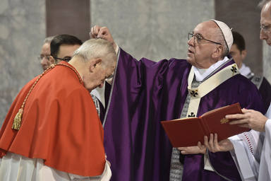 Pope Francis sprinkles ashes on a cardinals head during the Ash Wednesday mass at the Santa Sabina Basilica in Rome