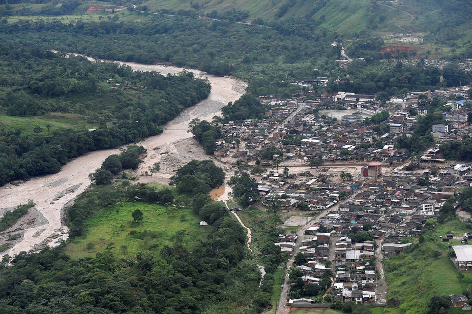 An aerial view shows a flooded area after heavy rains caused several rivers to overflow, pushing sediment and rocks into buildings and roads in Mocoa