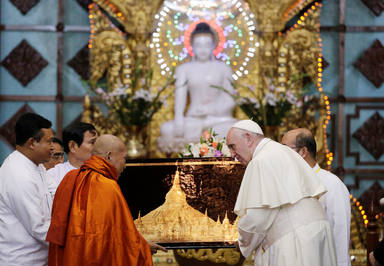 Pope Francis and Bhaddanta Kumarabhivasma, chairman of the state Sangha Maha Nayaka Committee, talk during a meeting with the Buddhist committee in Yangon