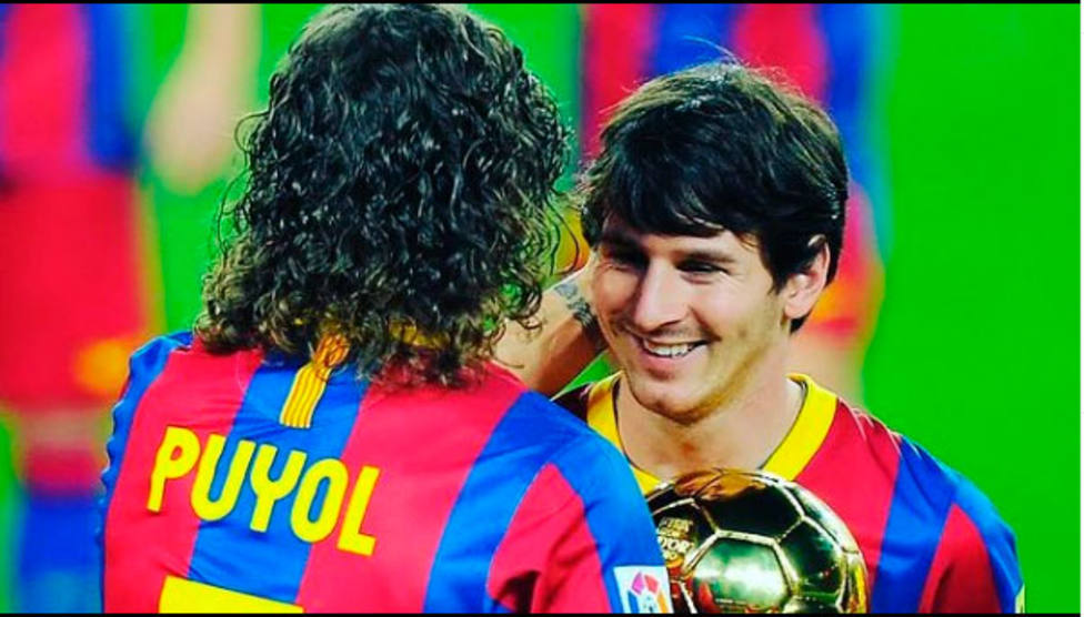 Carles Puyol y Leo Messi