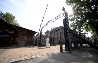Pope Francis walks through Auschwitzs notorious gate during his visit to the former Nazi death camp