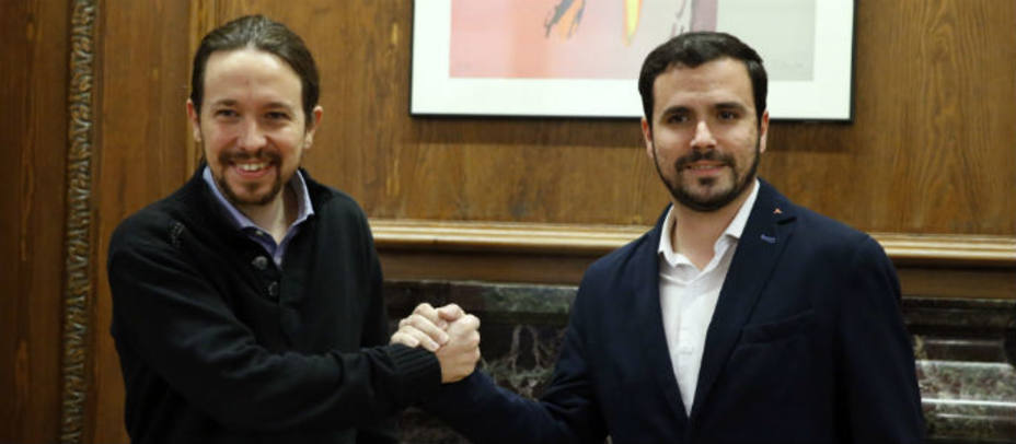 El secretario general de Podemos, Pablo Iglesias y el portavoz de IU-UP, Alberto Garzón. EFE