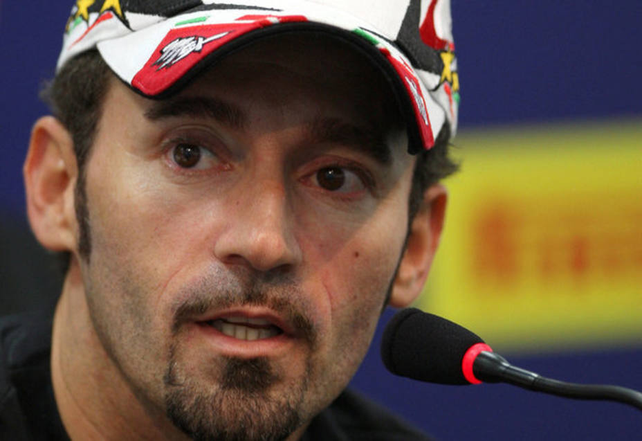 FILE PHOTO: Italys superbike rider Biaggi talks during a news conference at the Superbike World Championship in Doha