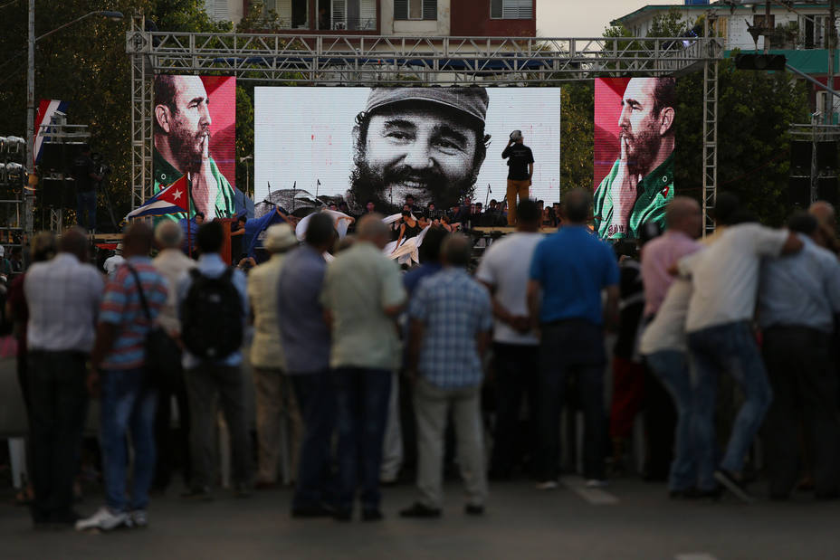 A screen displays an image of late Cuban President Fidel Castro during a ceremony to mark the 57th anniversary of the declaration of the socialist character of the Cuban Revolution in Havana
