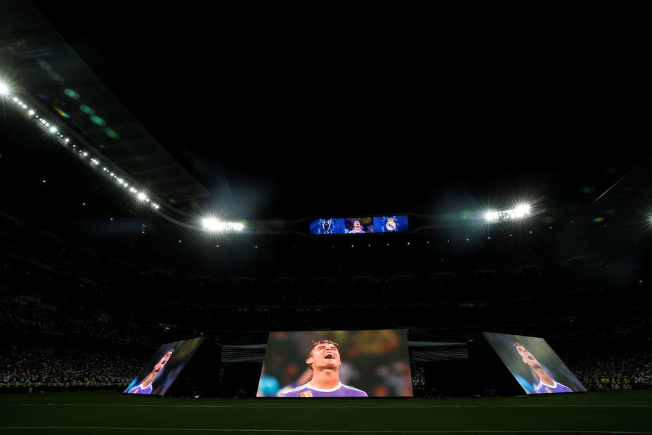 Real Madrid fans watch the Champions League final match at Santiago Bernabeu Stadium