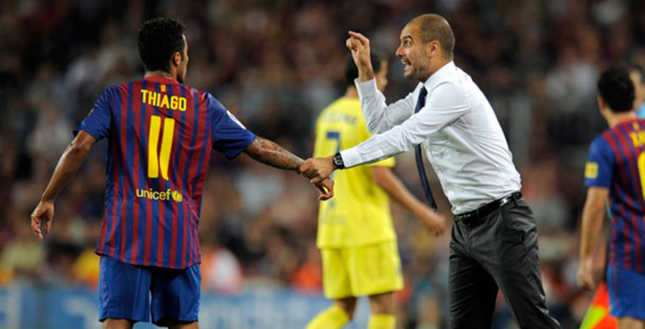 Thiago y Guardiola, durante un partido con el Barça