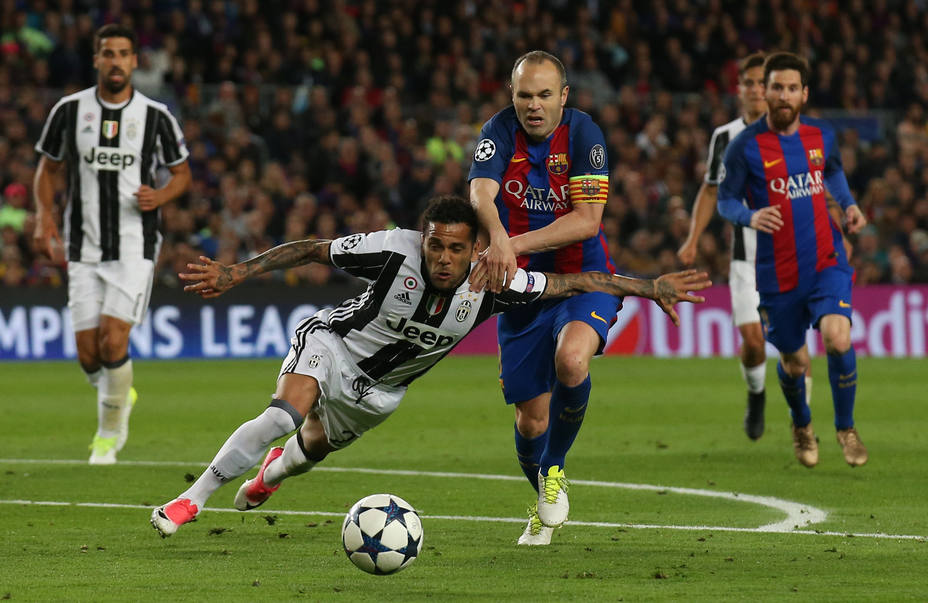 Barcelonas Andres Iniesta in action with Juventus Dani Alves