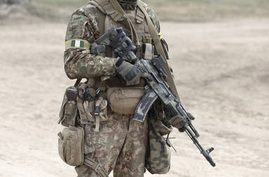 Soldier,With,Machine,Gun,And,Flag,Of,Nigeria,On,Military