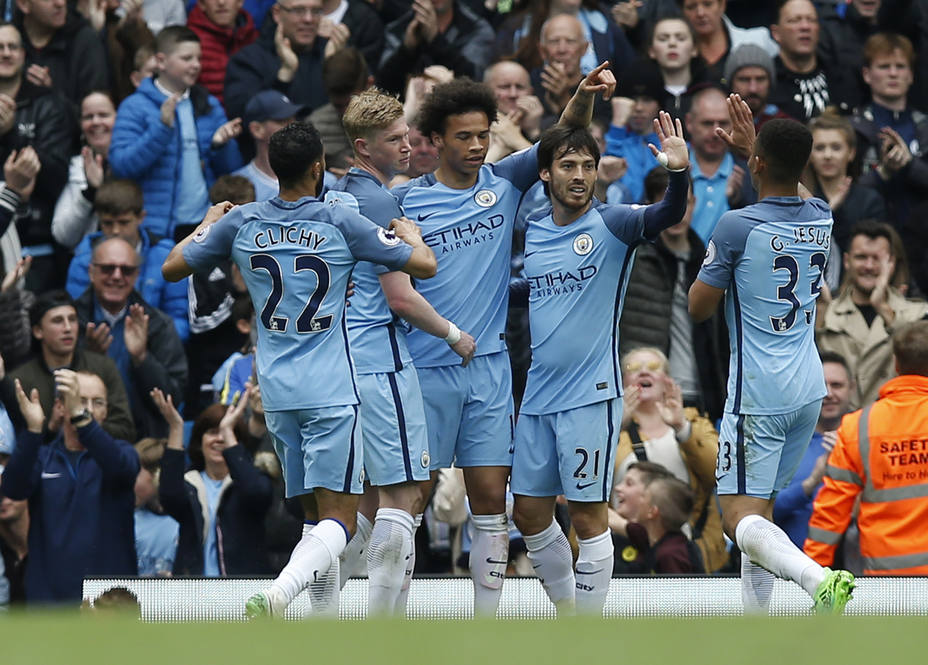 Manchester Citys David Silva celebrates scoring their first goal with team mates