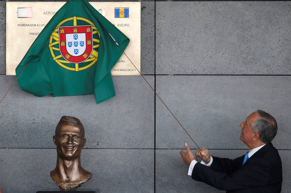 Portugals President Marcelo Rebelo de Sousa unveils a plaque during the ceremony to rename Funchal airport as Cristiano Ronaldo Airport in Funchal