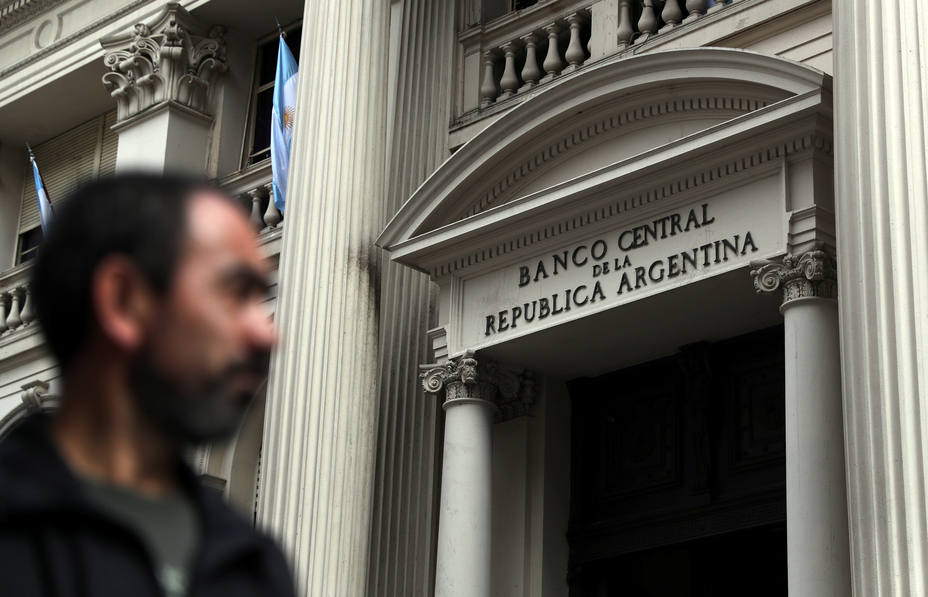 A man walks past Argentinas Central Bank in Buenos Aires financial district