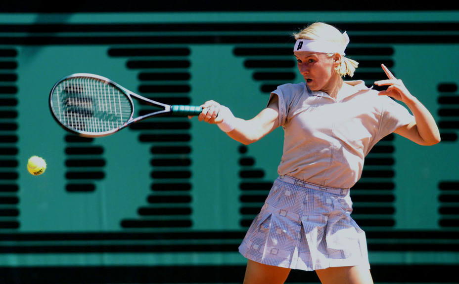 FILE PHOTO: Jana Novotna of the Czech Republic returns a forehand to compatriot Adriana Gersi during their match on the second day of the Roland Garros French tennis open