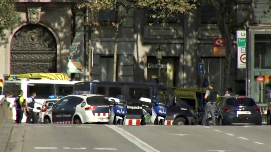 A still image from video shows a police cordon on a street in Barcelona, Spain following a van crash